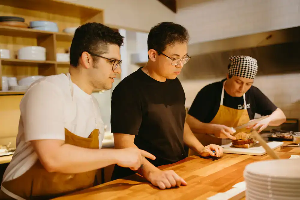 Chefs preparing a refined seasonal menu