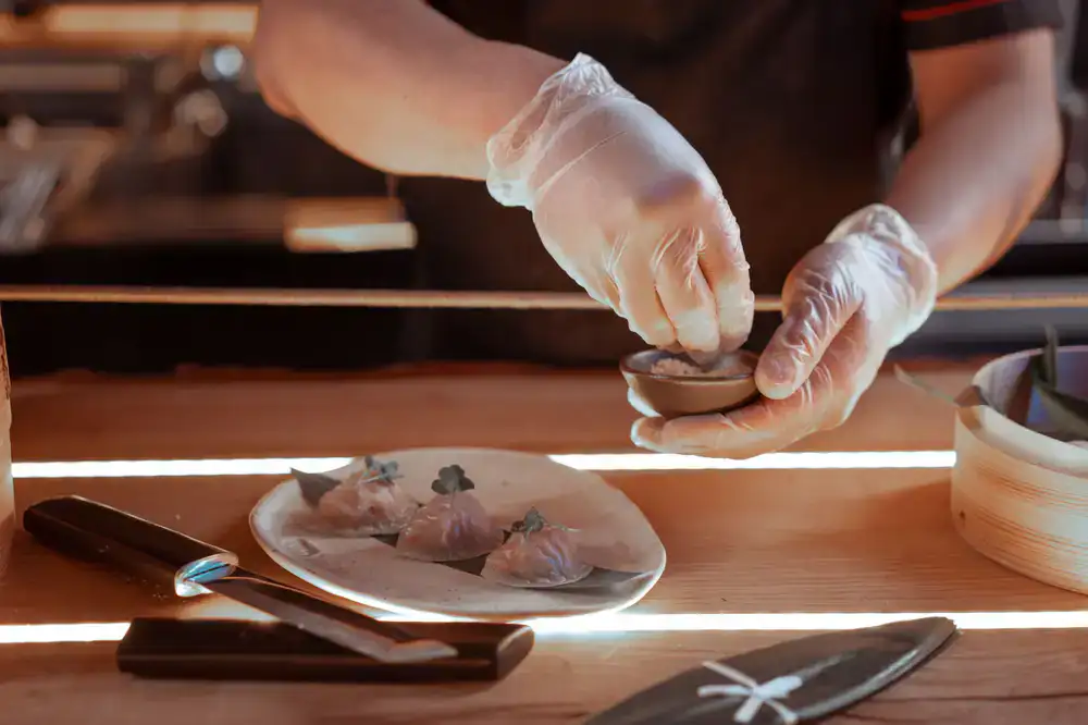 Chef plating a delicate appetizer