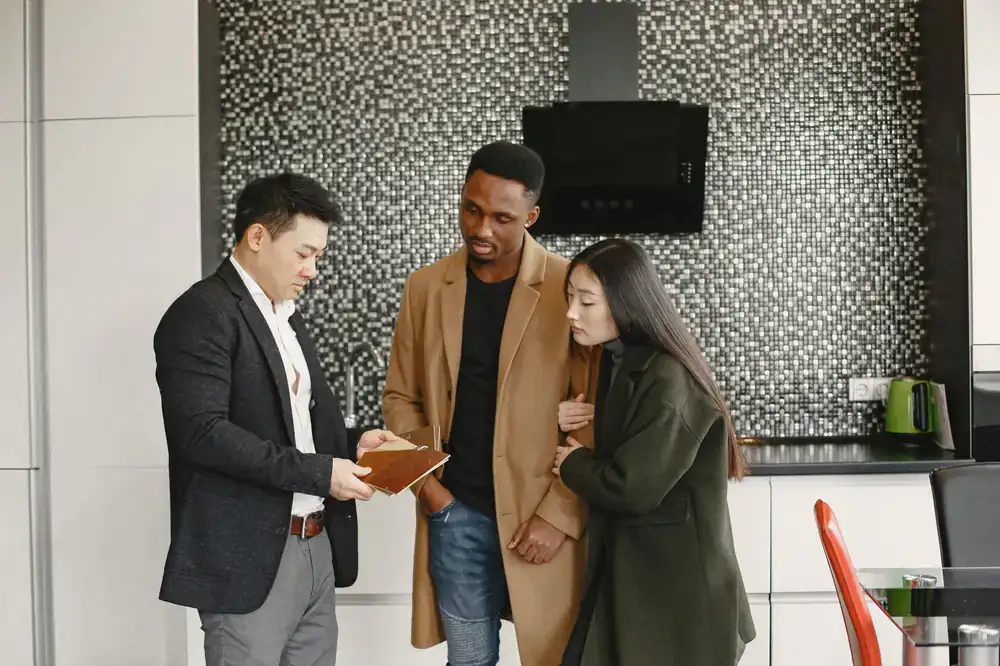 Catering manager discussing the menu options with clients